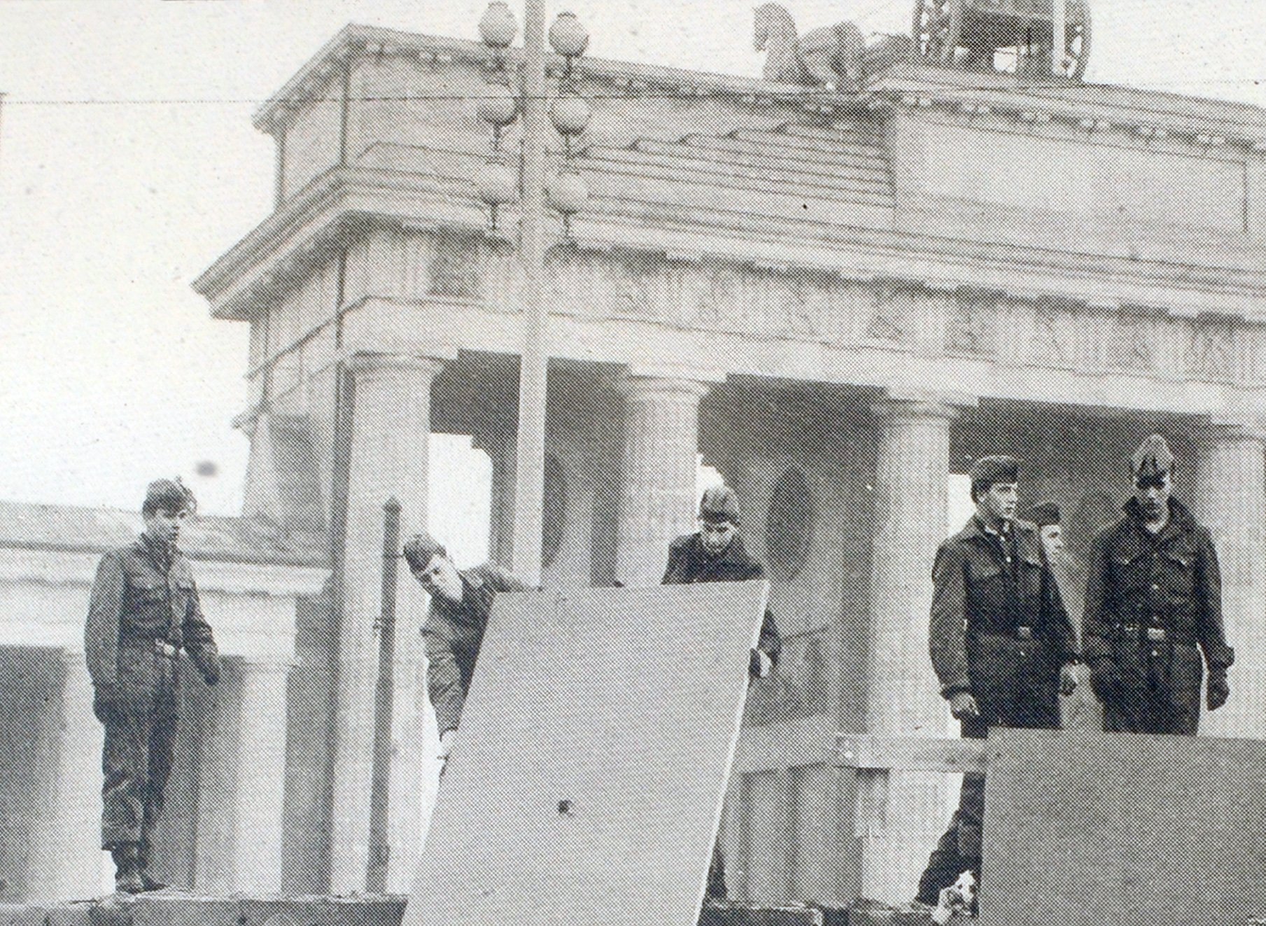 Grayscale Portrait Photo of Berlin wall construction 1961