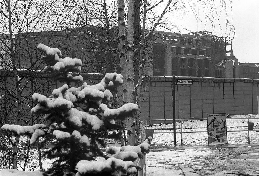 Grayscale Photo of Berlin Wall at Potsdamer Platz
