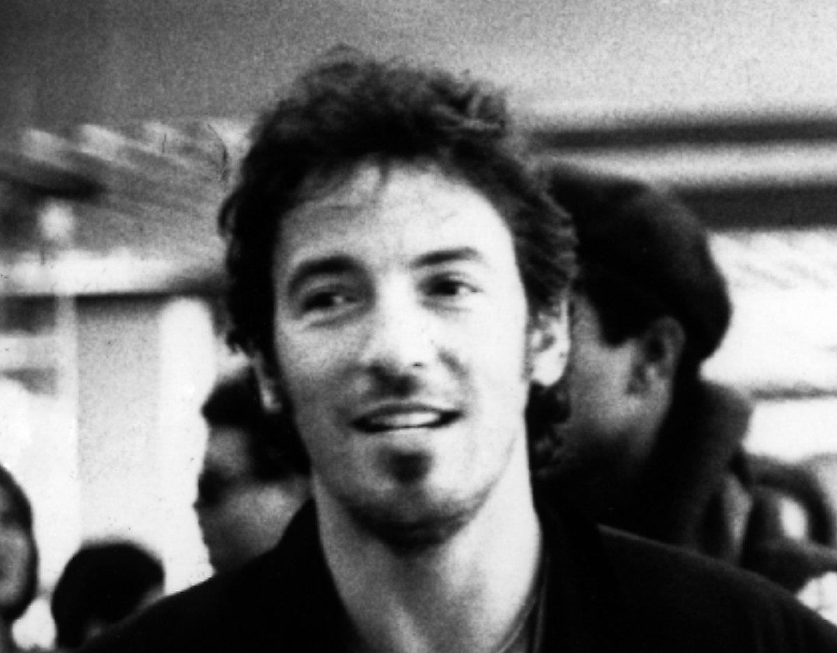 Grayscale Photo of Bruce Springsteen in dark outfit