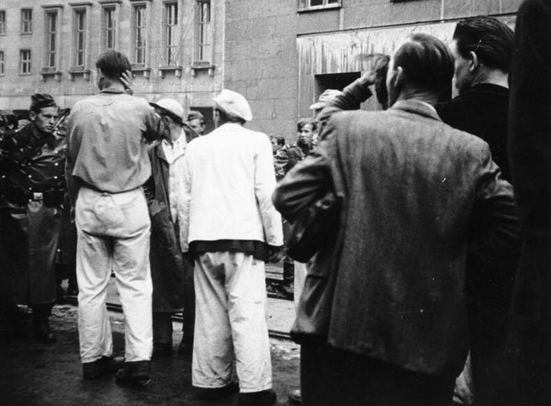 Grayscale Portrait Photo of People on the streets of Berlin 1953