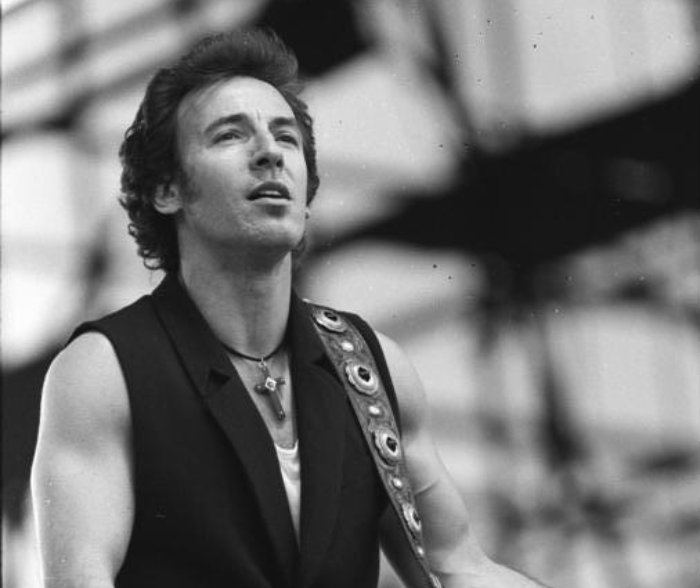 Grayscale Portrait Photo of Bruce Springsteen in concert
