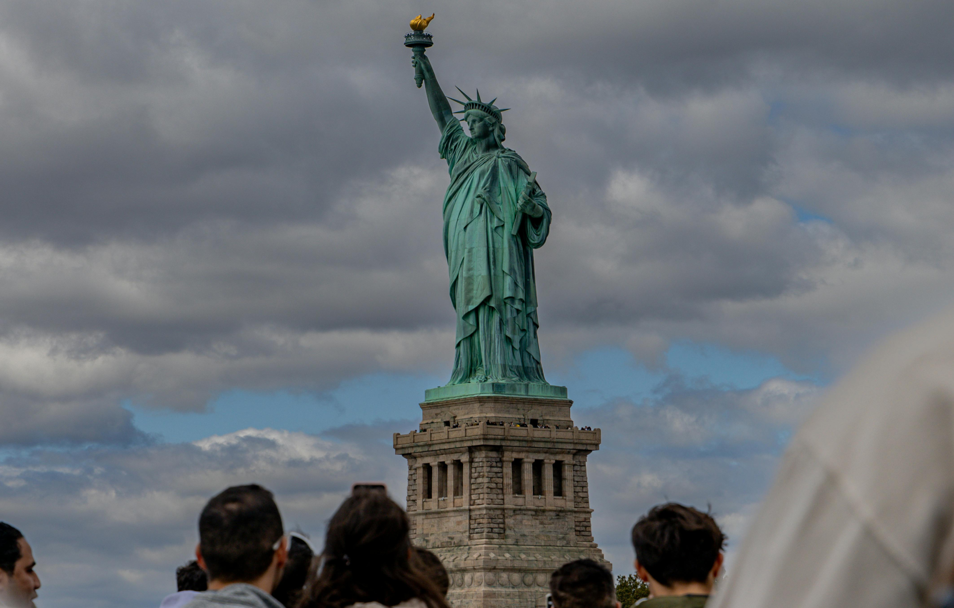 People Standing by Statue of Liberty in USA