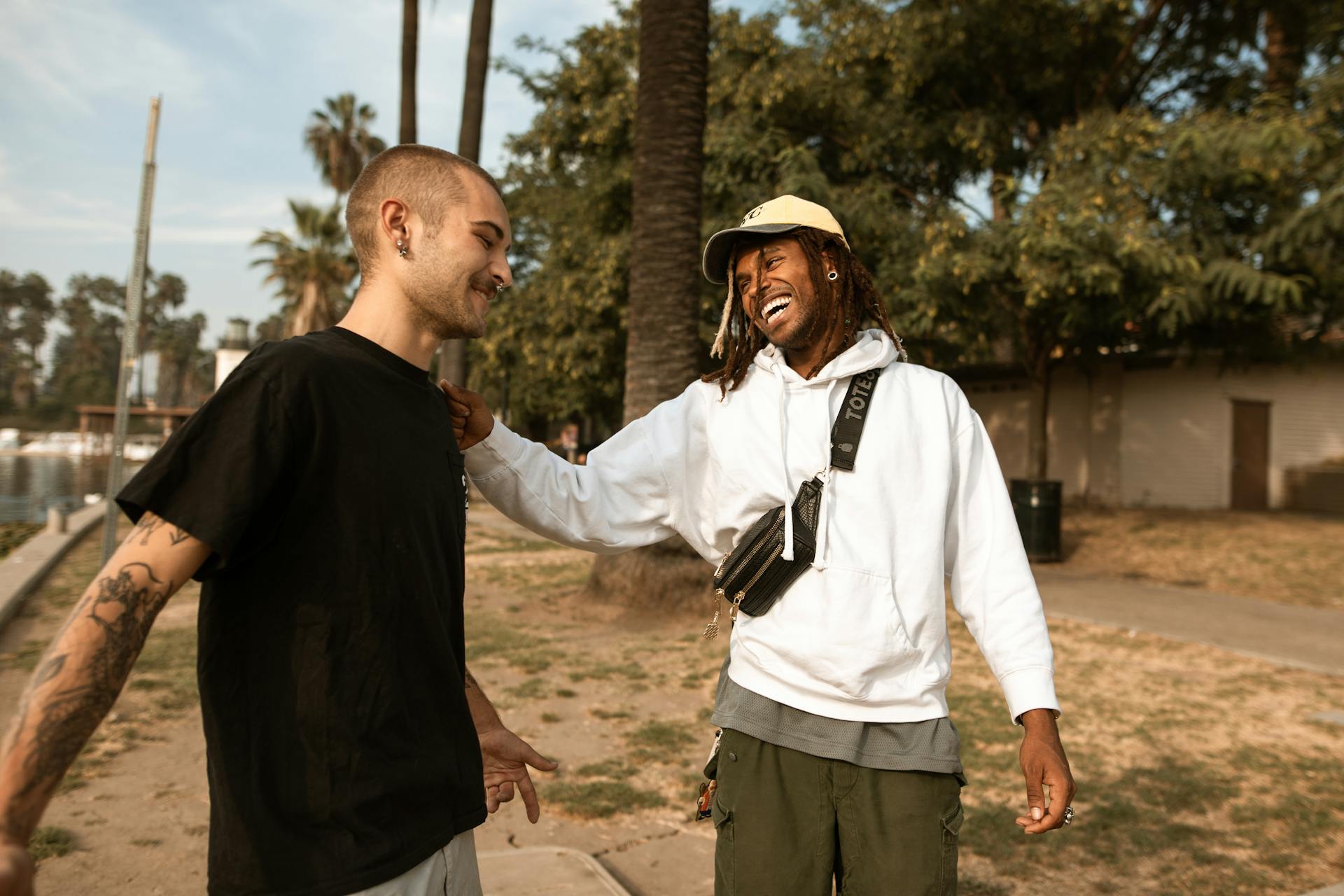 Friends Greeting Each Other at the Park