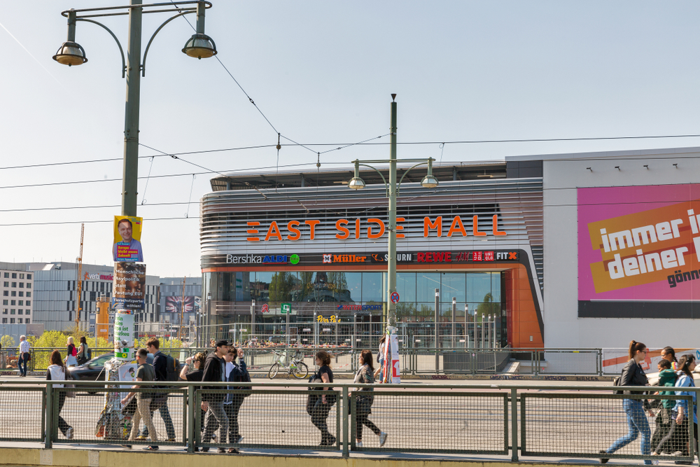 People walk in front of East Side Mall in Berlin