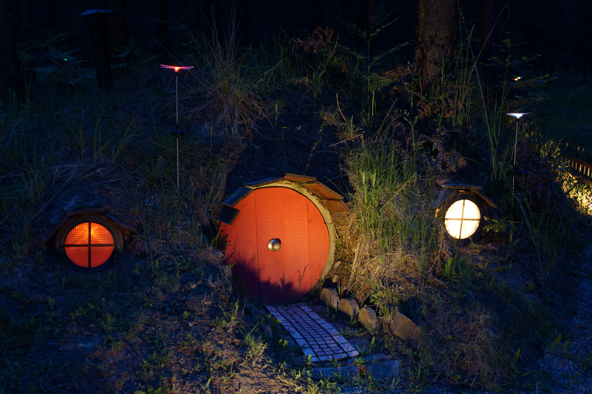 Hobbit House at night at The Shire of Montana