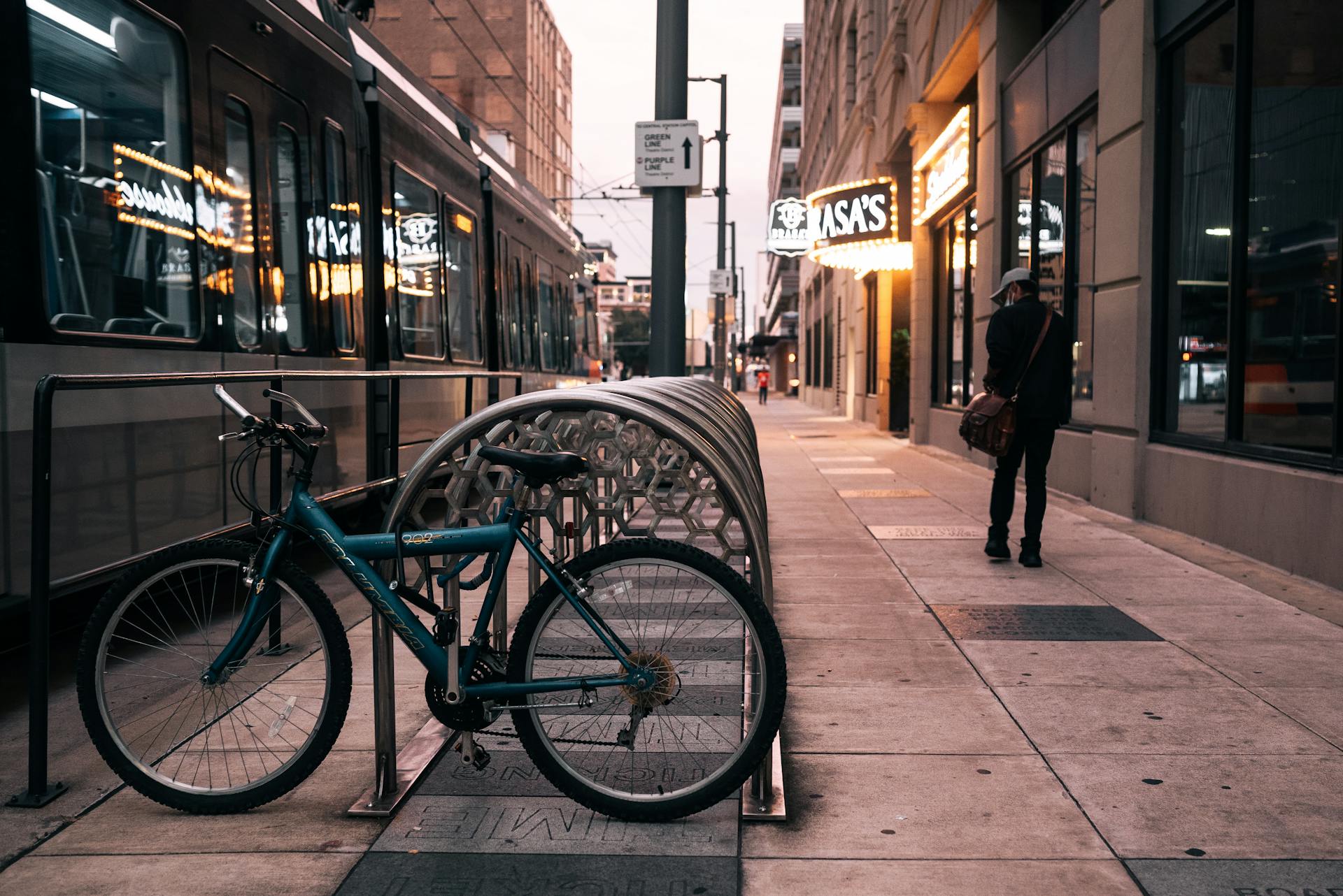 Blue City Bike Parked Beside Sidewalk