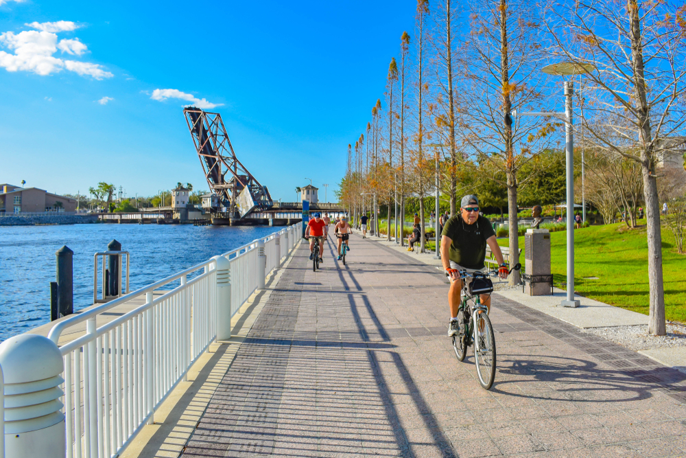 People biking at Riverwalk in downtown area