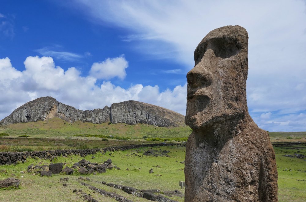 Moai stone statue with a view to Ranu Raraku vulcano on Easter Island