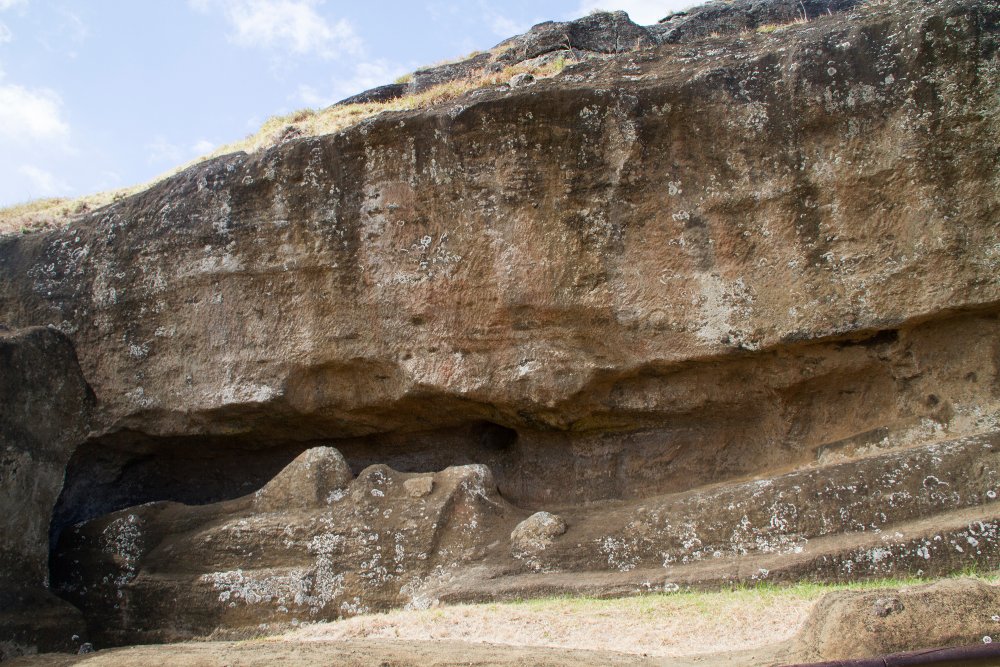 Statue, Moai in the process of being carved out of the rock at Rano Raraku Easter Island