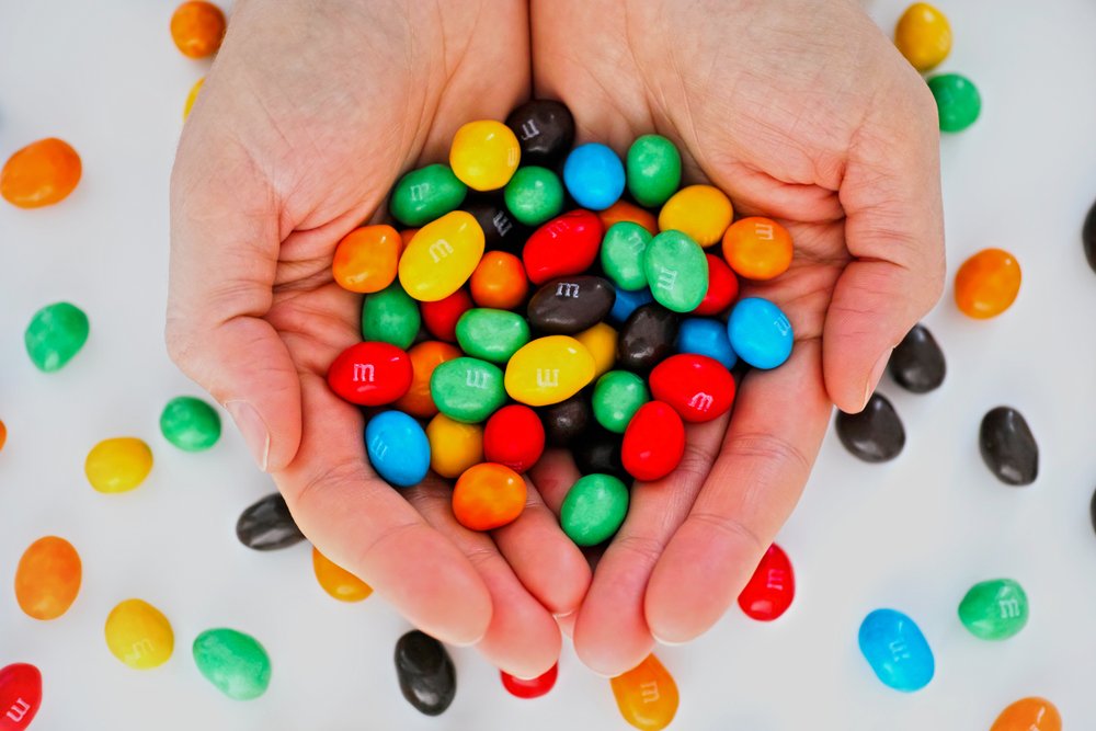 M&Ms candy in woman hands