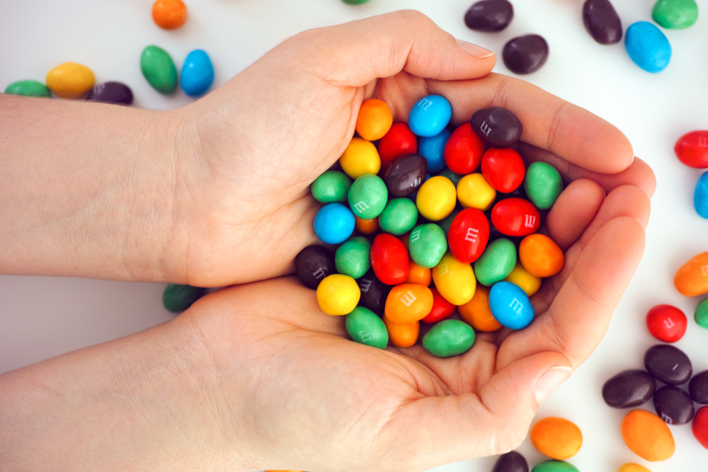 M&Ms candy in woman hands