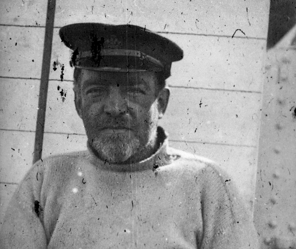 Sir Ernest Shackleton sitting on board the Antarctic exploration vessel Aurora - circa 1917
