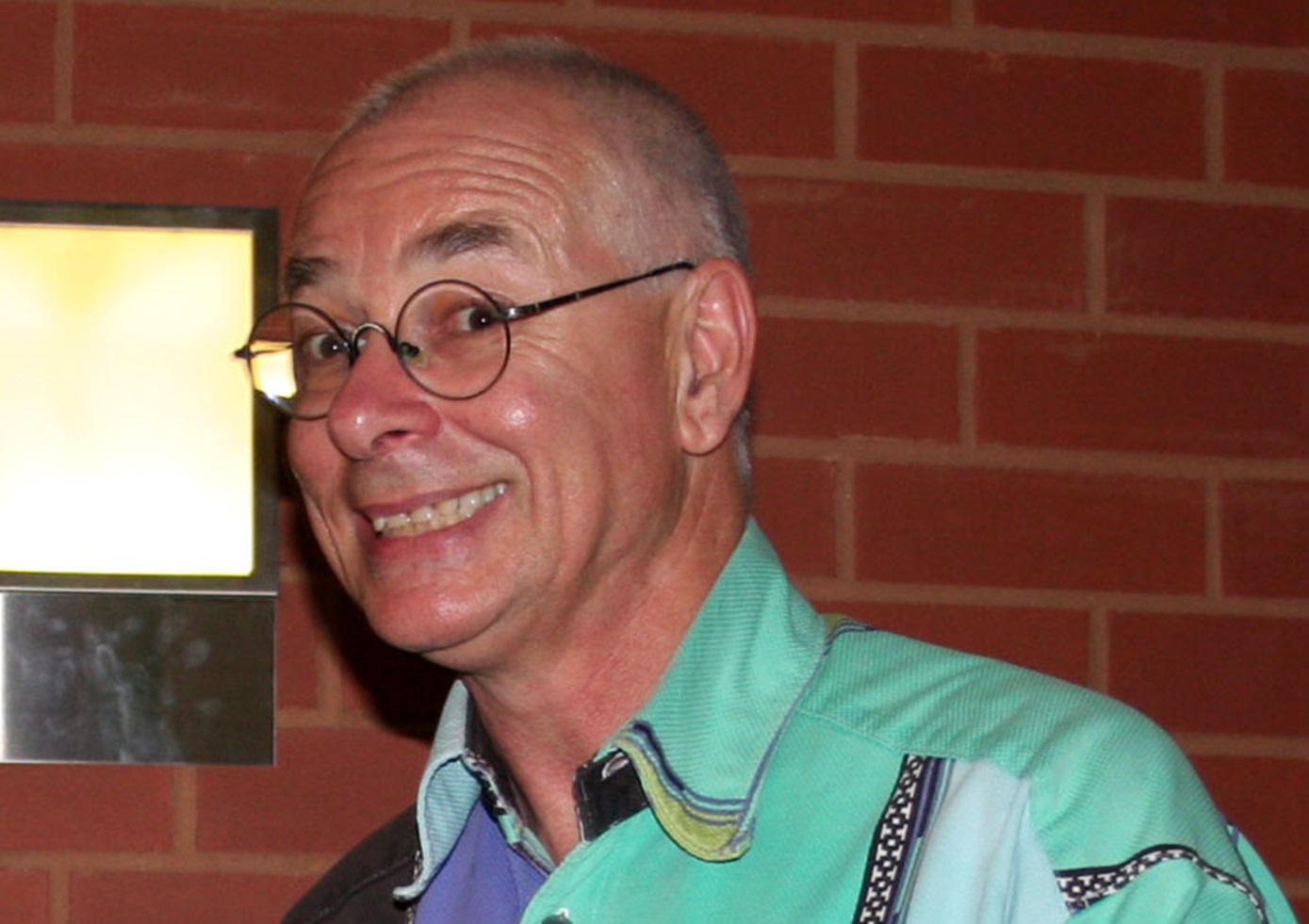 Karl Kruszelnicki holding a copy of his book