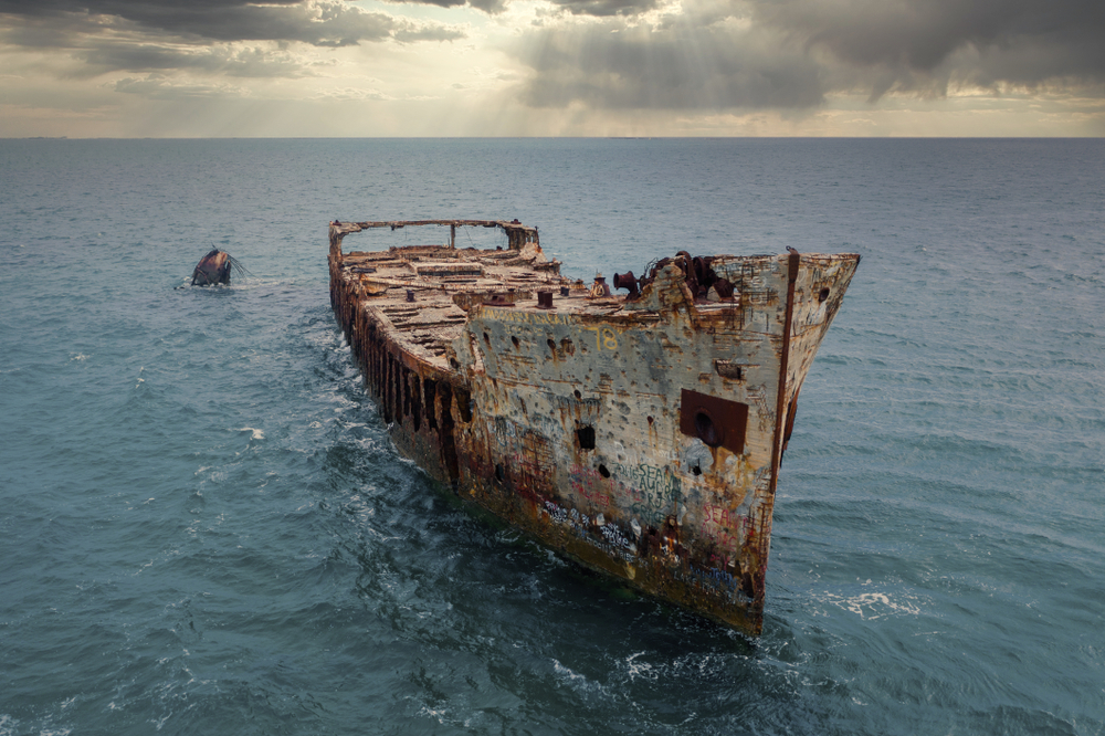 The infamous Sapona concrete ship sits wrecked in the shallow waters of the Caribbean Sea near the Bahamas
