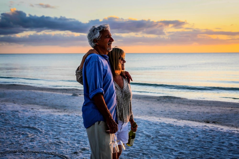 Active retirees enjoy the sunset on Siesta Key beach