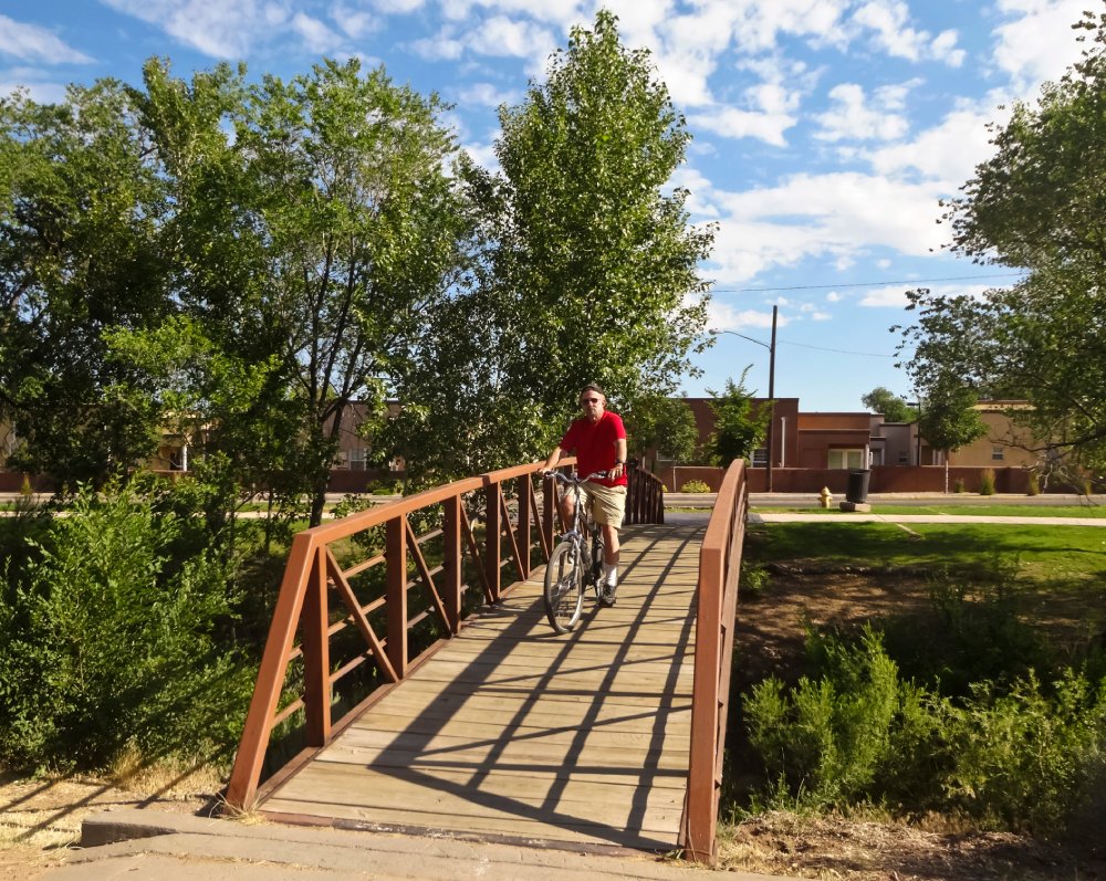 Portrait Photo of A Cyclist Rides the Santa Fe River Trail