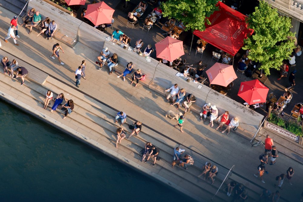 Aerial view of people sitting and walking on the Chicago riverwalk