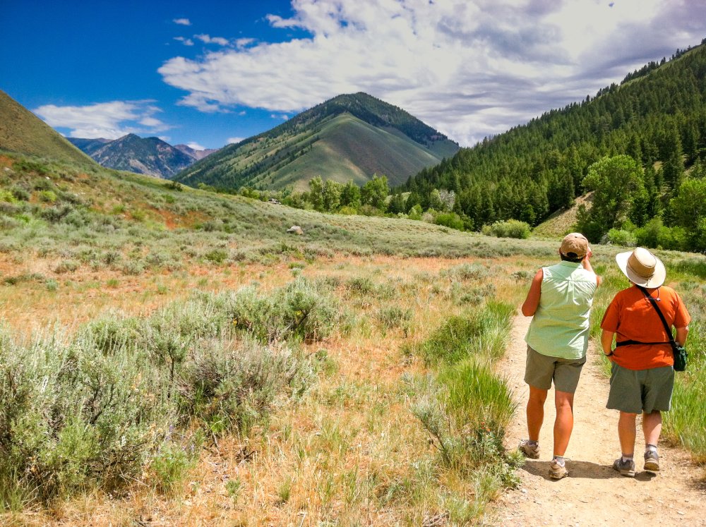 Portrait Photo of Two People hiking in Hailey Idaho, Cloudy Sky in the Background