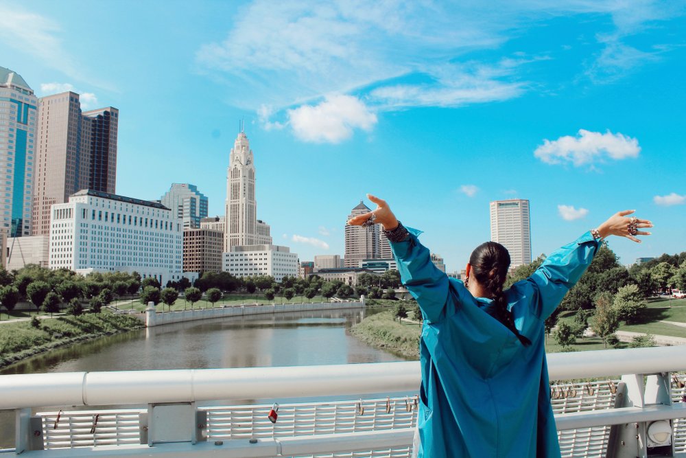 Woman in front of Columbus Ohio city skyline