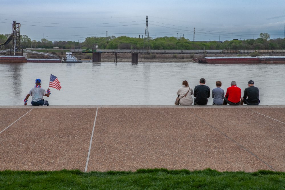 Tourists taking in view of Mississippi River in St. Louis Missouri