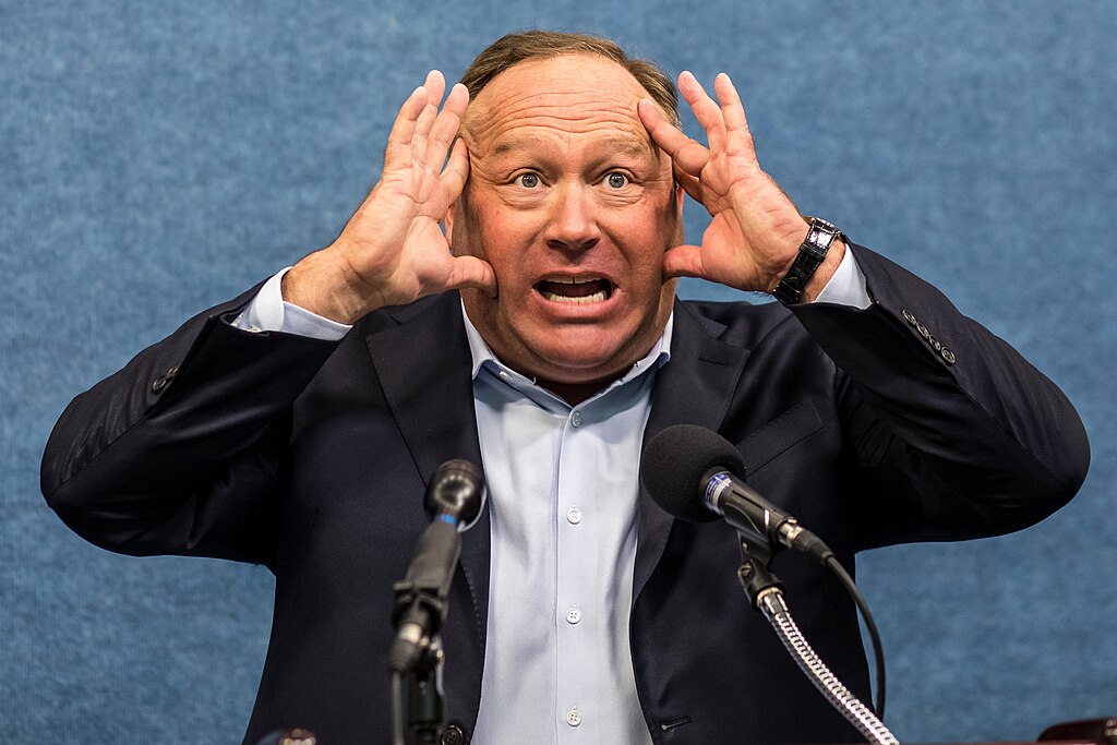 Portrait Photo of Alex Jones in a dark suit