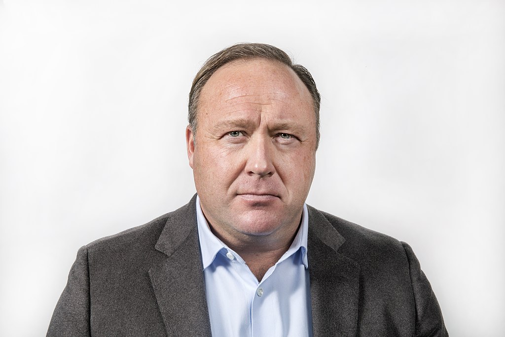 Portrait Photo of radio host Alex Jones in brown outfit