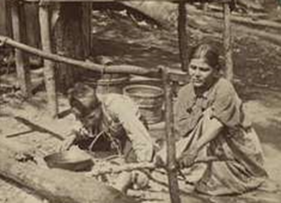 Iroquois woman making food.