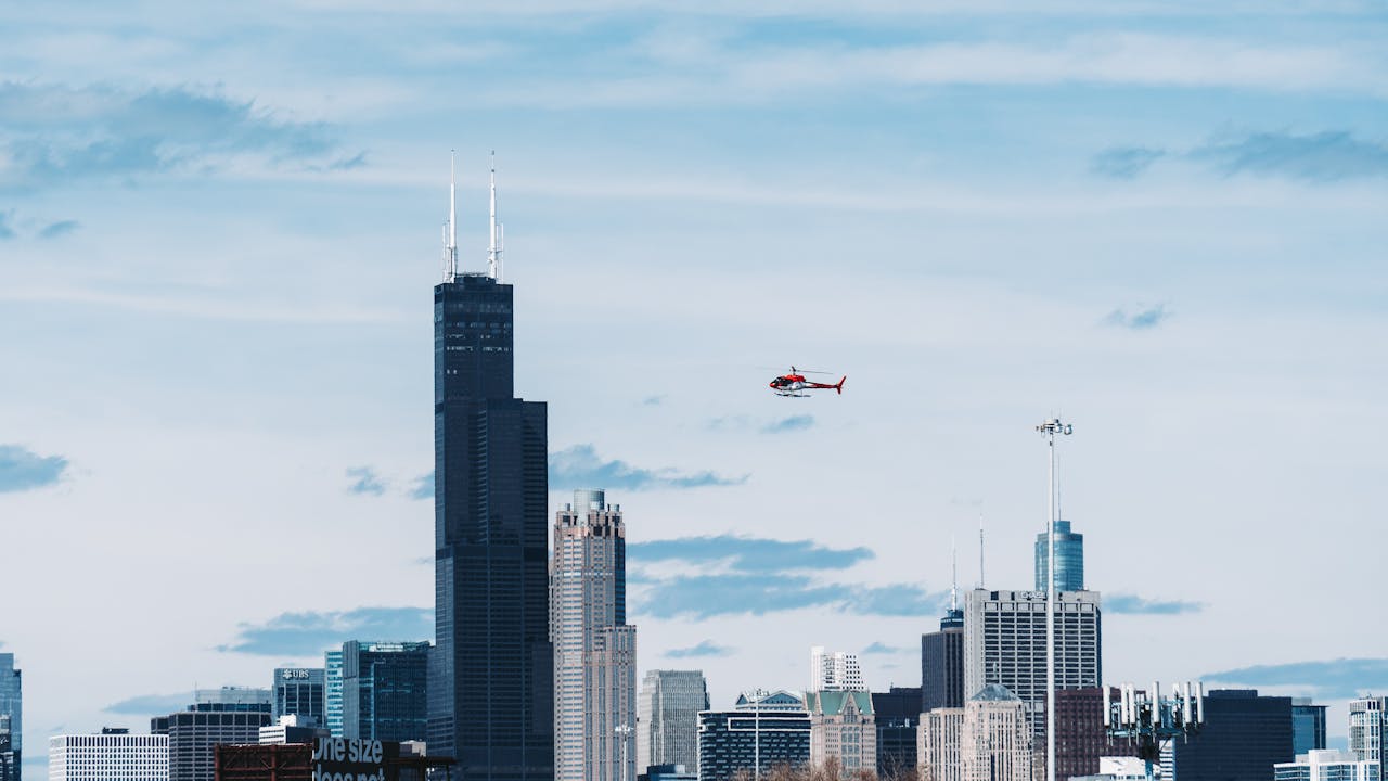 Helicopter Above Willis Tower Building
