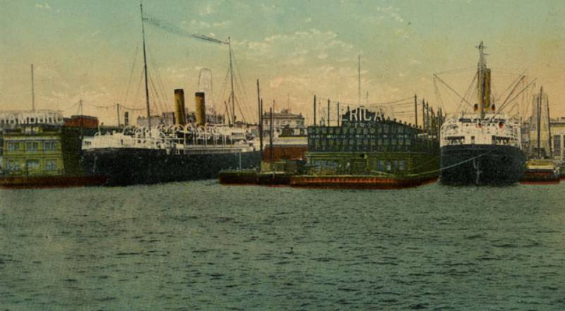 A view from the water of the Hamburg-American Lines Piers at Hoboken, NJ.