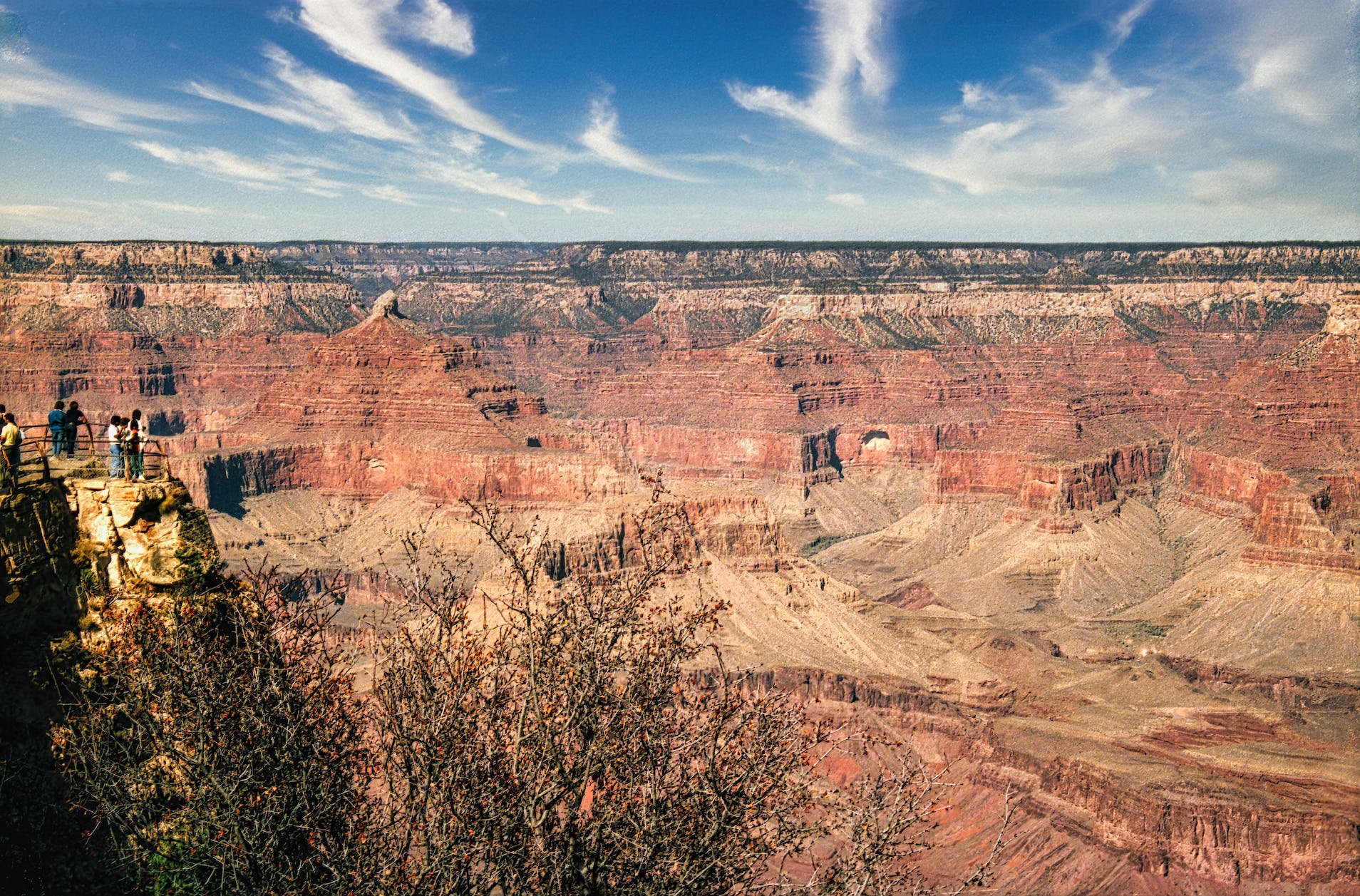 Landscape Photo of the Grand Canyon with people standing on cliff