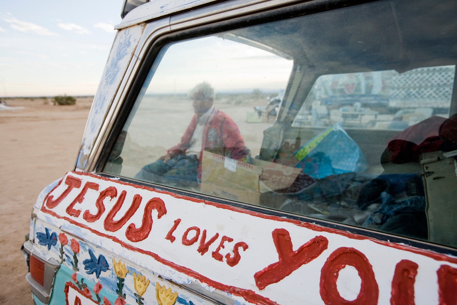 Leonard Knight sits next to one of his vehicles. - 2020