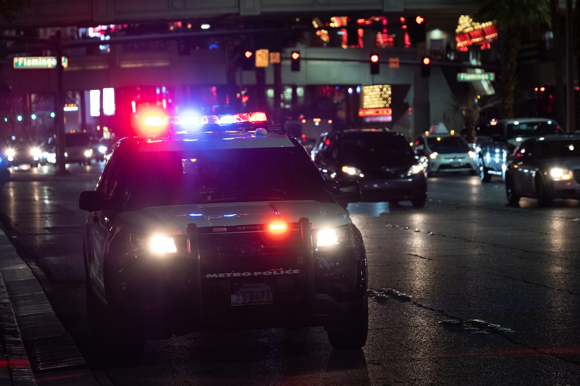 Police car on the street at night.
