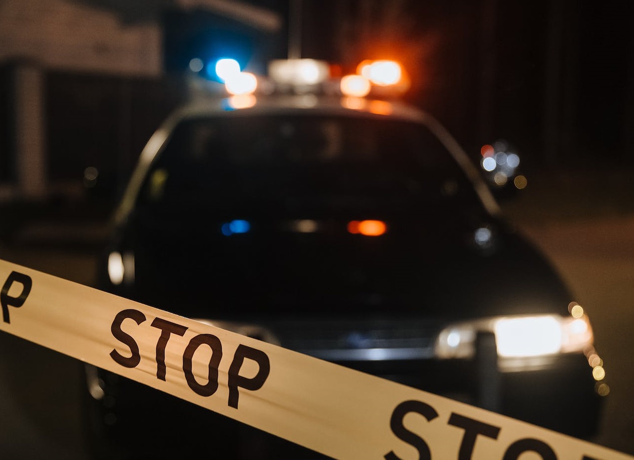 Police car outside at night.