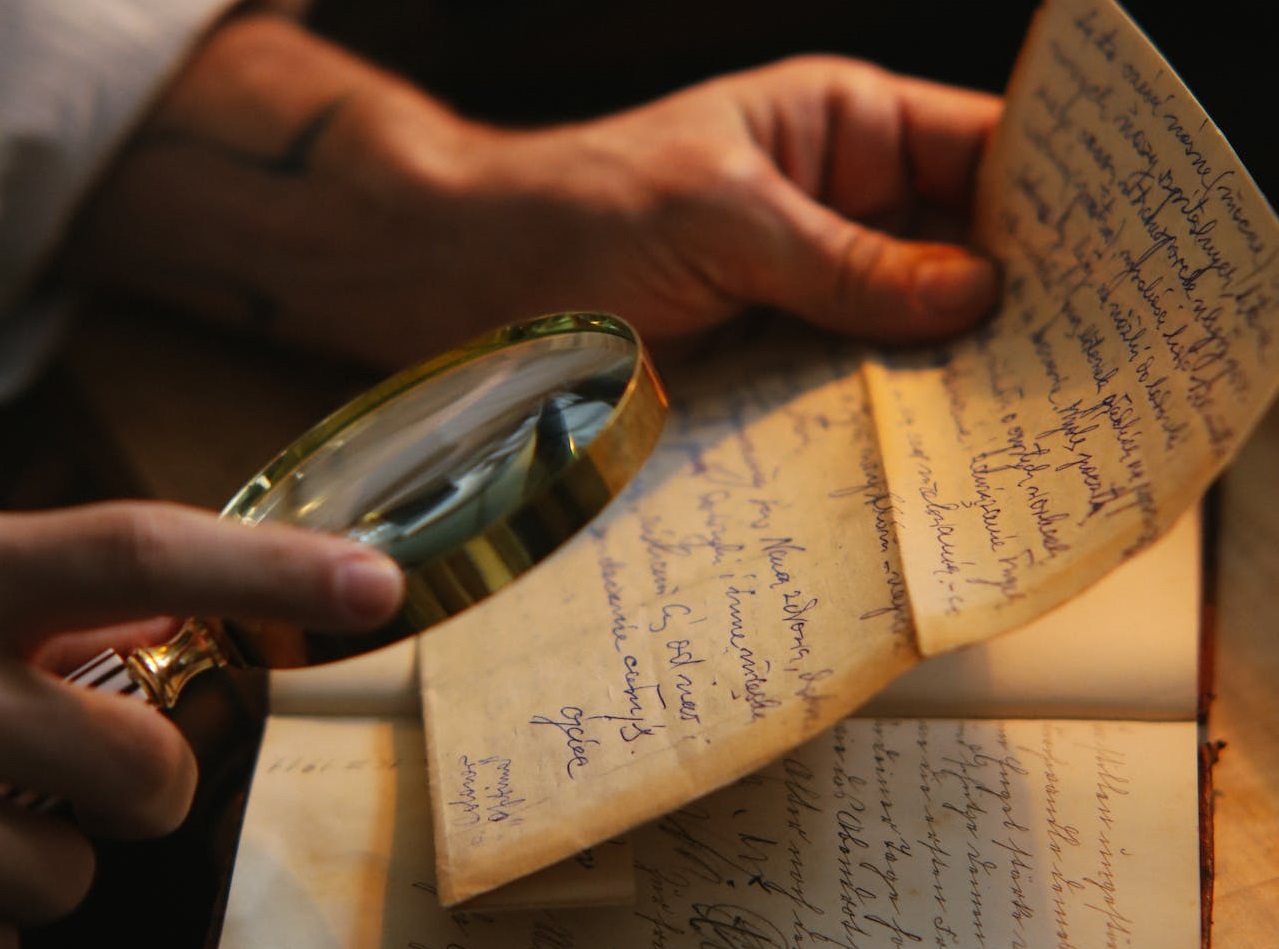 Man reading a handwritten letter.