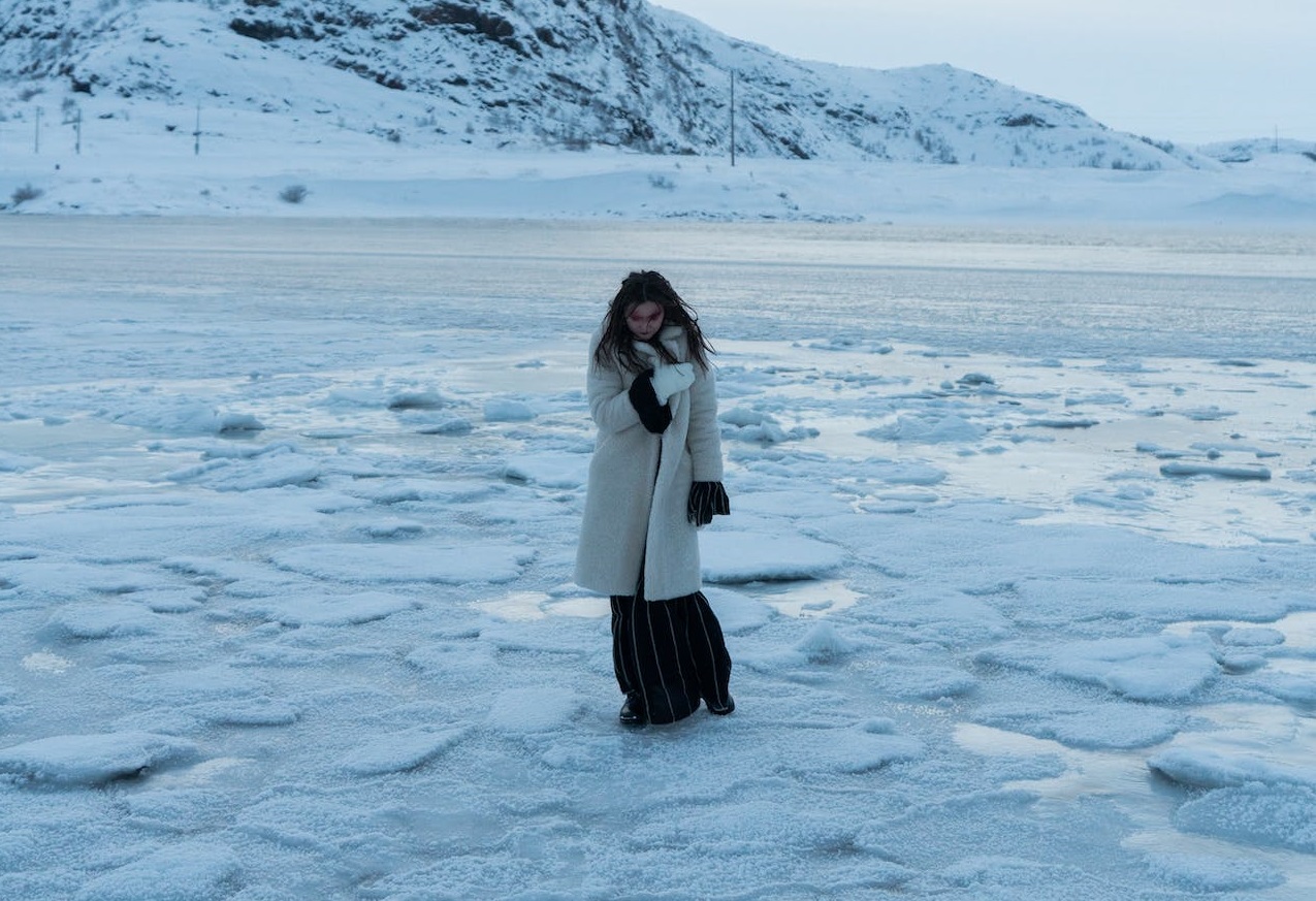 Woman walking on snow.
