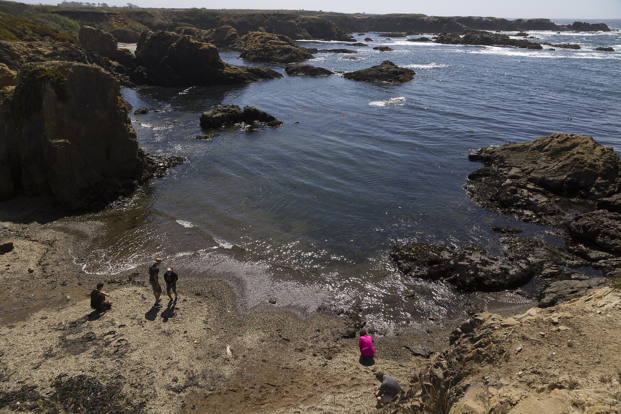Tourists on glass beach