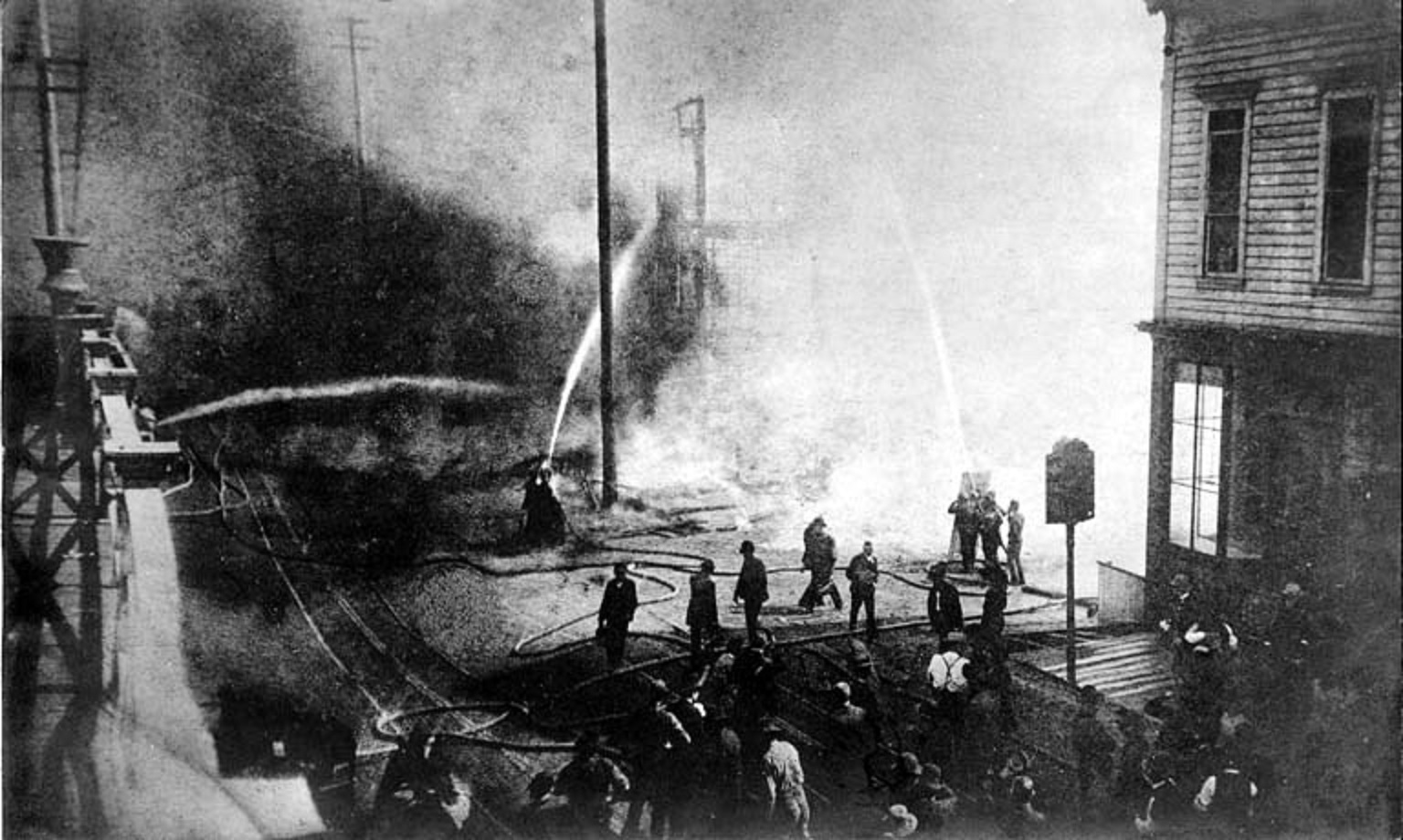 Start of the Great Seattle Fire of June 6, 1889, looking south on 1st Ave. near Madison St.