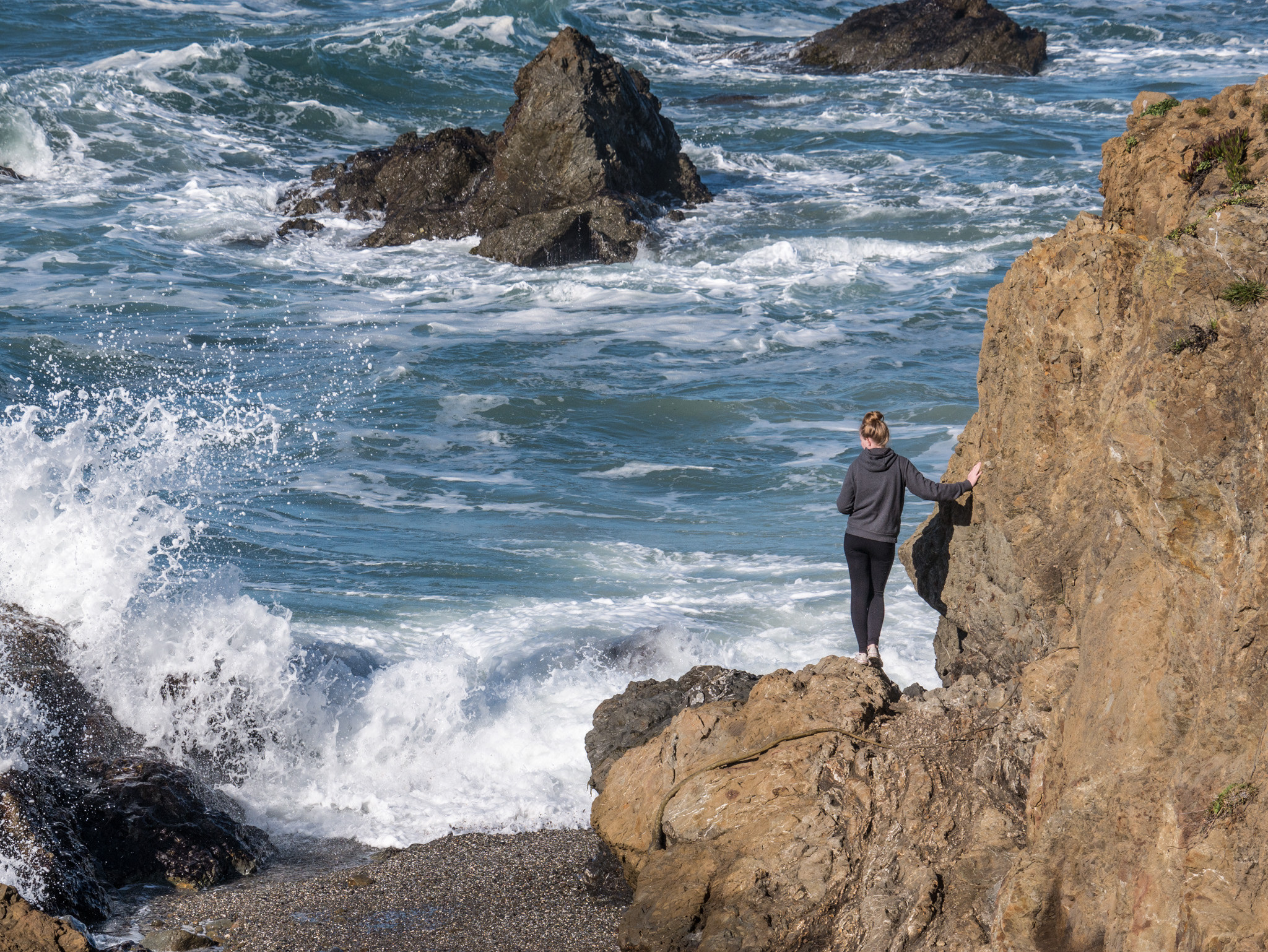 Girl Standing On A Rock At Glass Beach, Fort Bragg, California