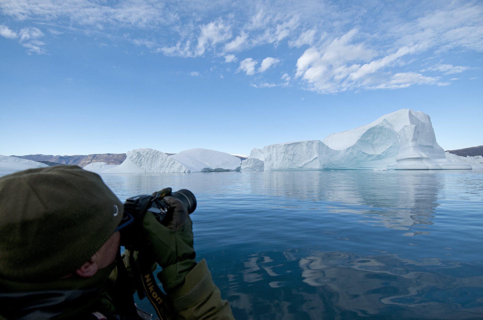 Tourist watching icebergs, Rødefjord, Northeast Greenland National Park - 2015
