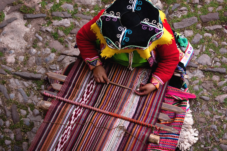 Indigenous Weaver A Quechua-speaking local woman weaving a runner