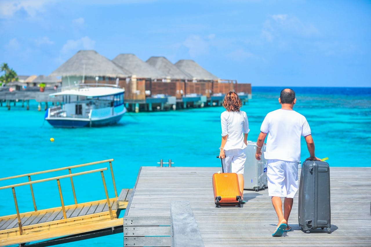 Man and woman are walking on dock.