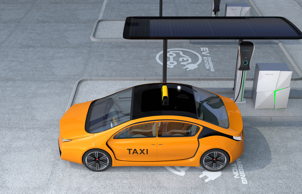 Yellow electric taxi charging