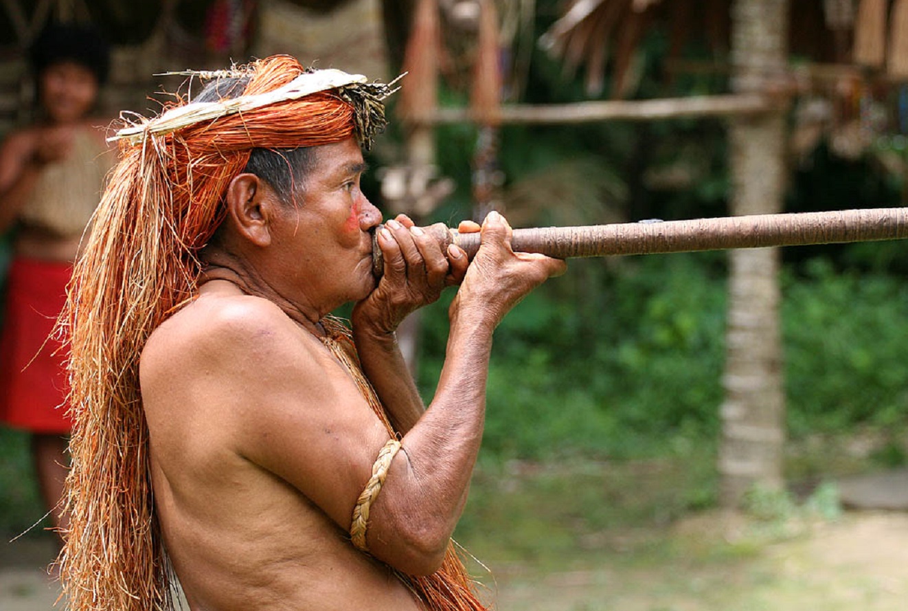 A Yagua tribe man demonstrating the use of blowgun.