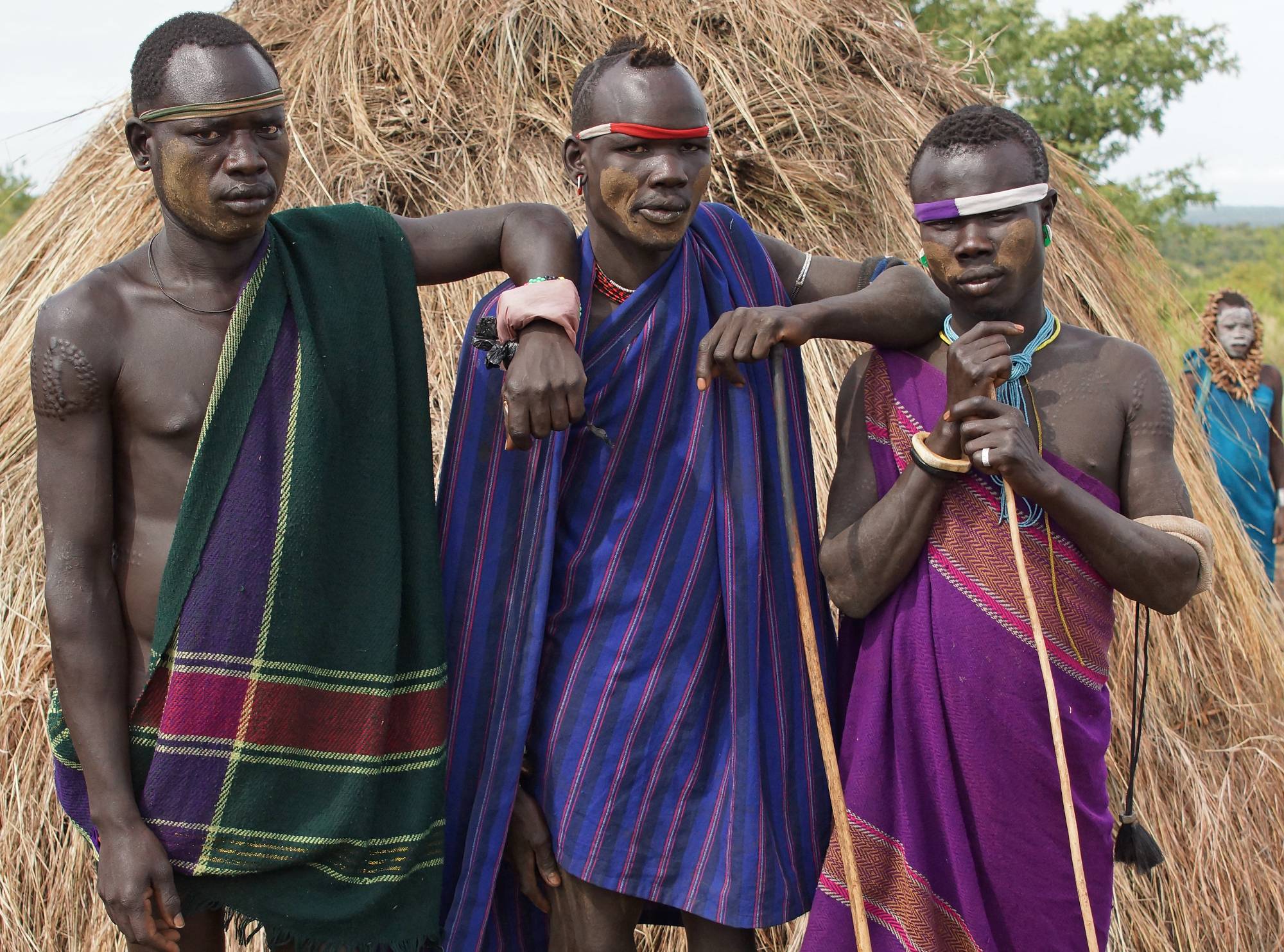 Mursi men with traditional clothing