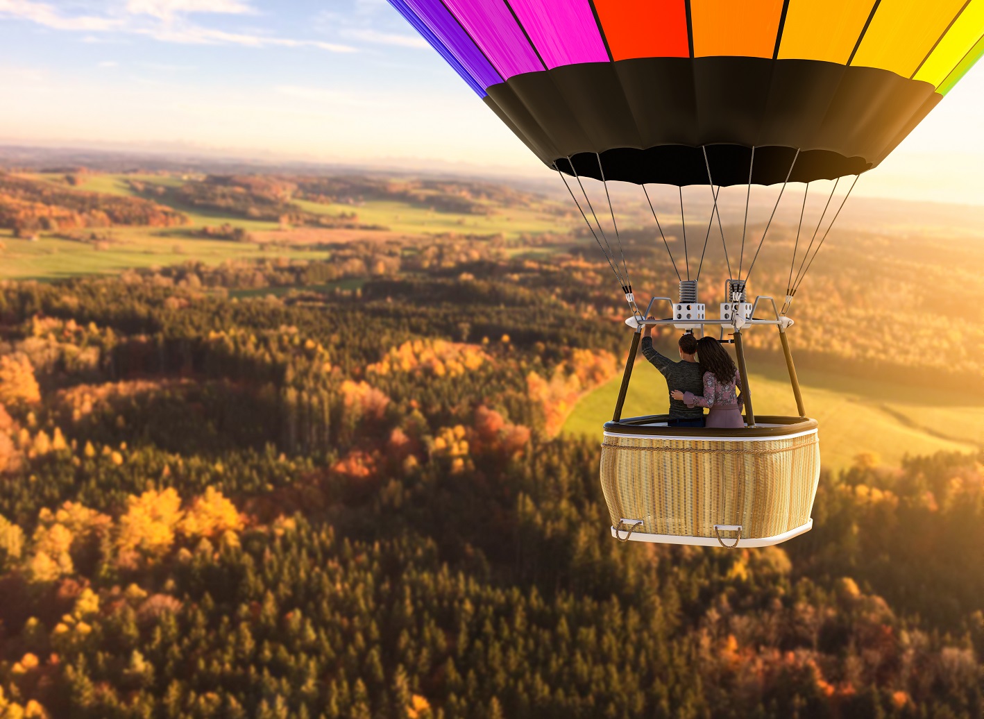 Aerial view of a European landscape from a hot air balloon with a loving couple.