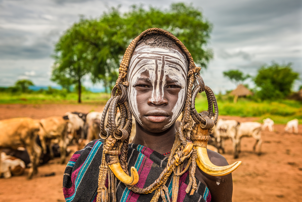 Young boy from the African tribe Mursi