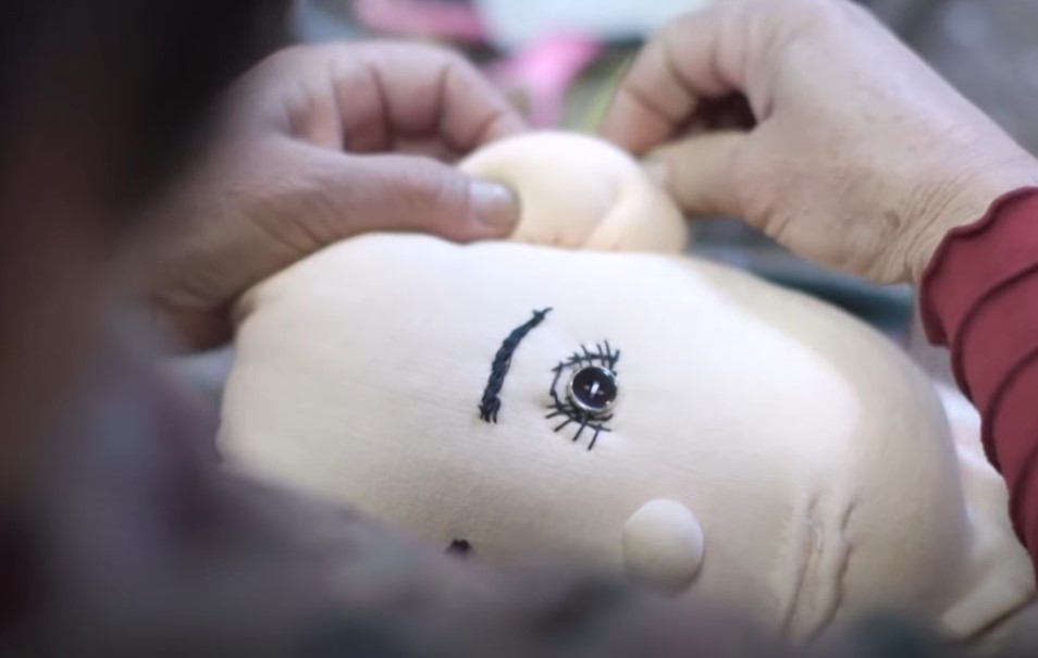 Tsukimi Ayano making a doll