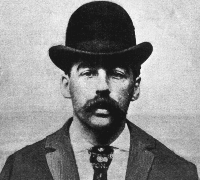 Grayscale Photo of H. H. Holmes, America's first serial killer.