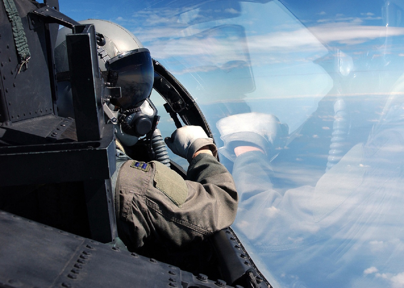 Pilot looking outside a plane cockpit.