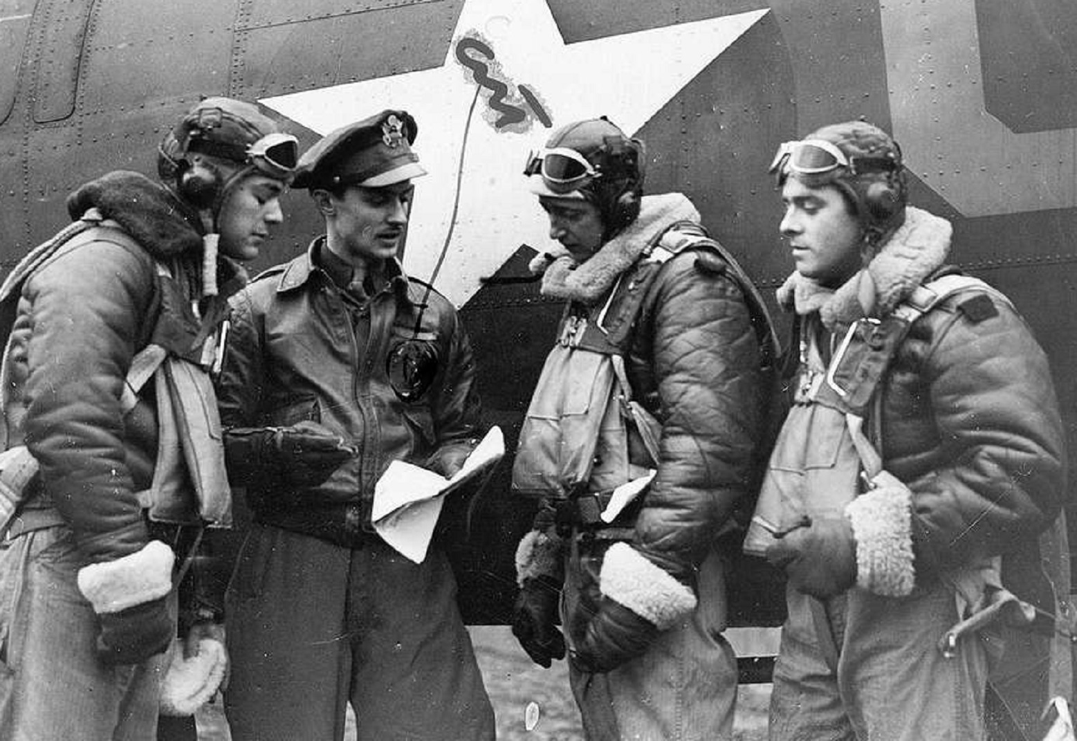 Bomb Group discuss their last mission. - 1943